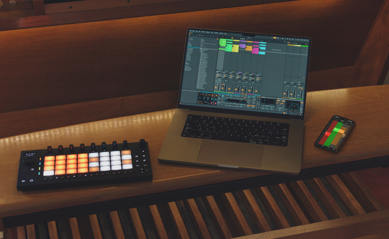 Ableton Live 12.4 running beside Ableton Push and Note in a studio workspace